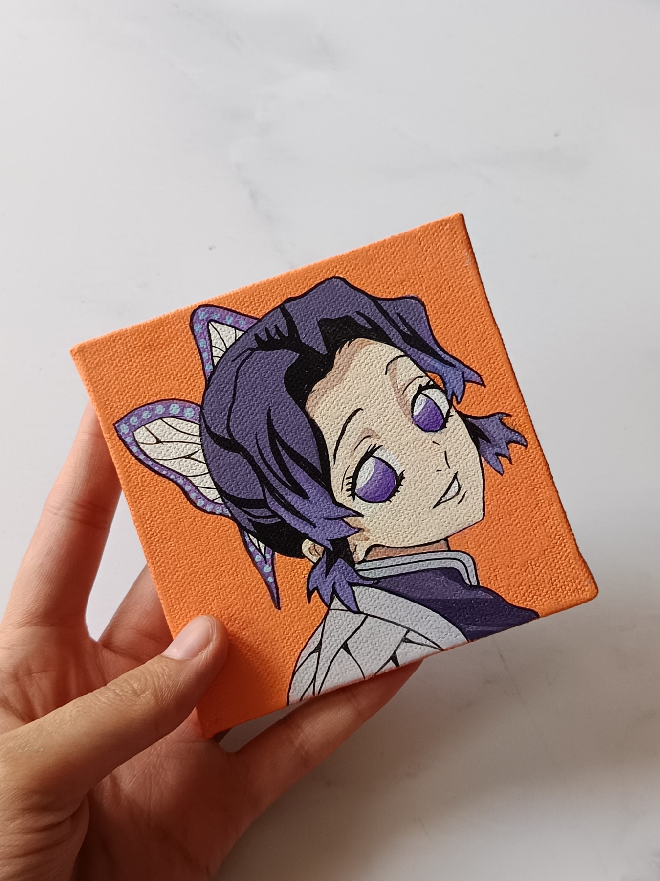 Side view of Shinobu Kocho hand-painted mini canvas fridge magnet by Tulika Viegas