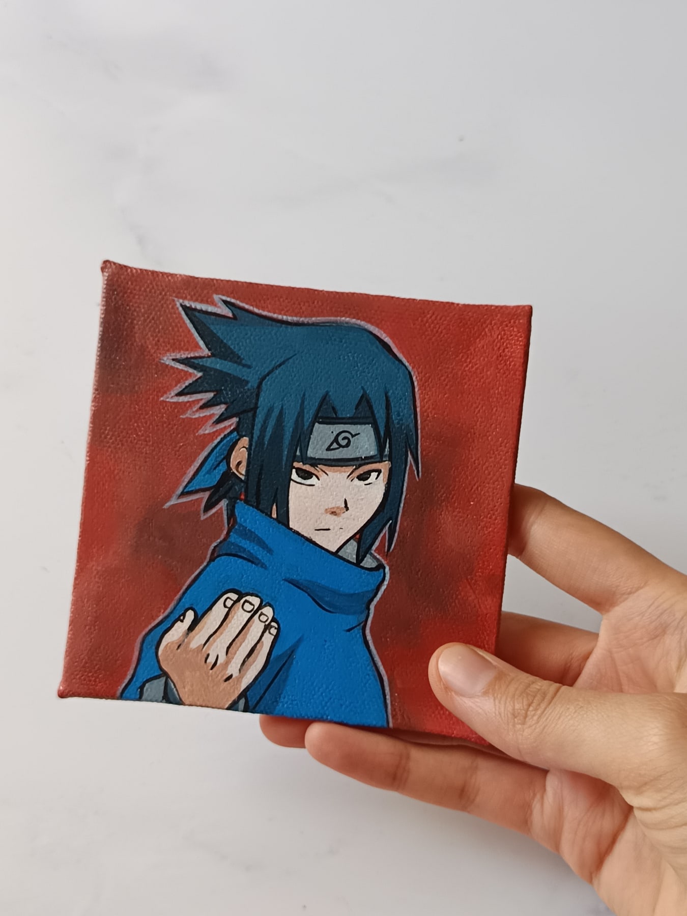 Side view of Sasuke Uchiha hand-painted mini canvas fridge magnet by Tulika Viegas