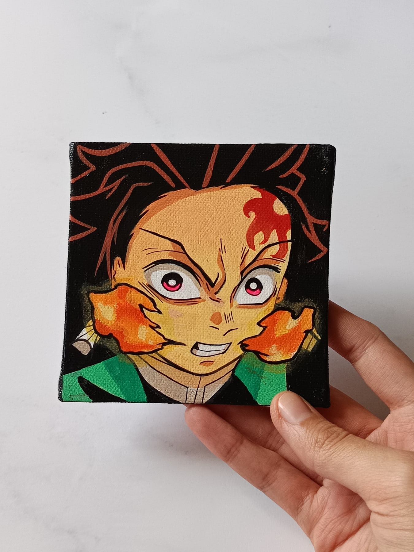 Side view of Tanjiro Kamado hand-painted mini canvas fridge magnet by Tulika Viegas