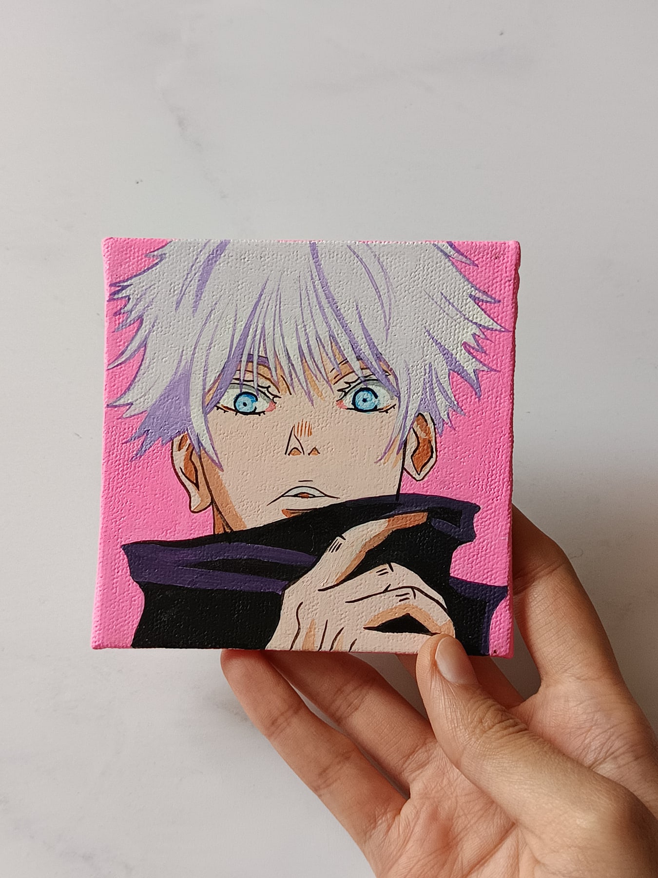 Side view of Satoru Gojo hand-painted mini canvas fridge magnet by Tulika Viegas