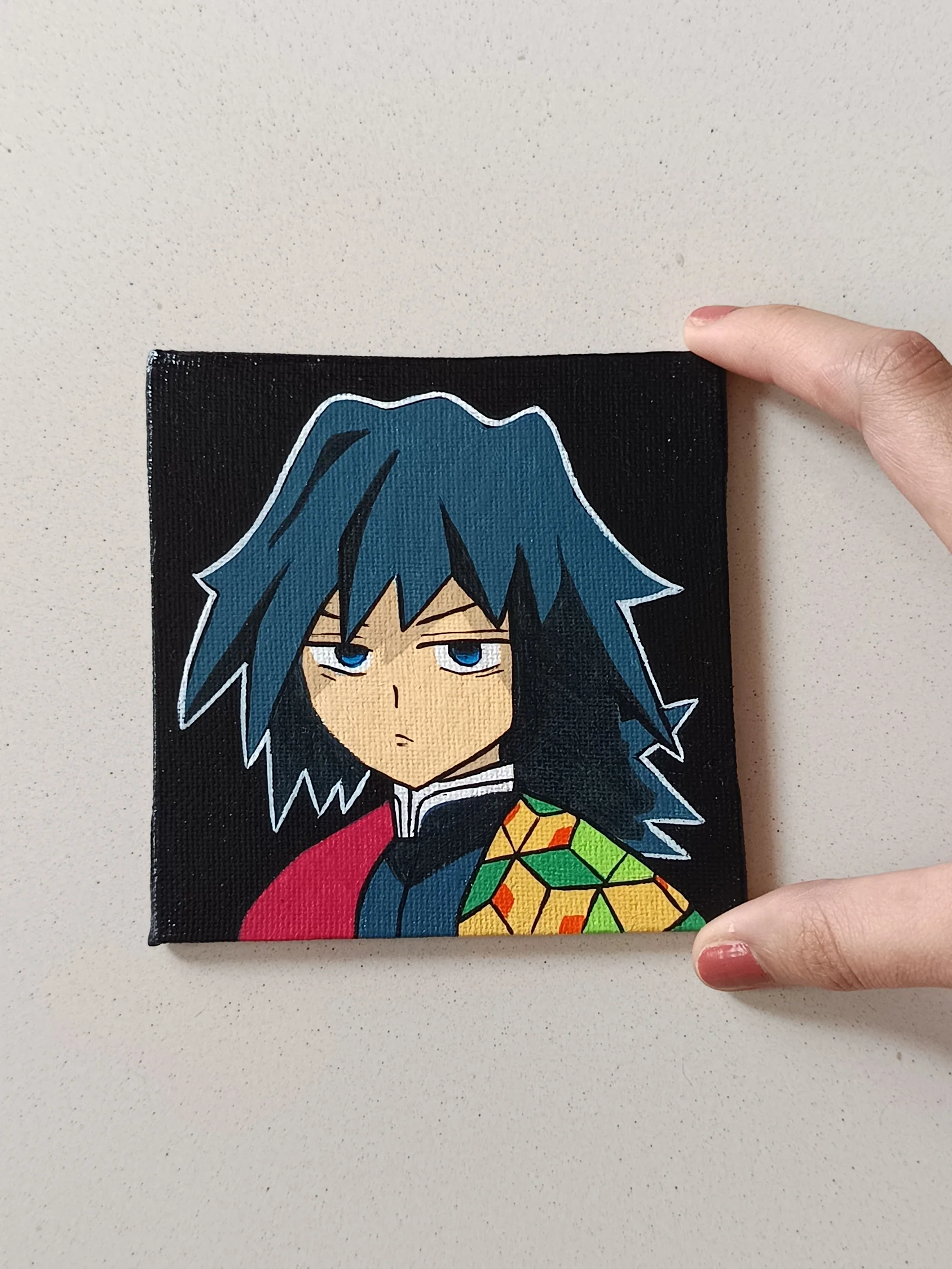 Side view of Giyu Tomioka hand-painted mini canvas fridge magnet by Tulika Viegas
