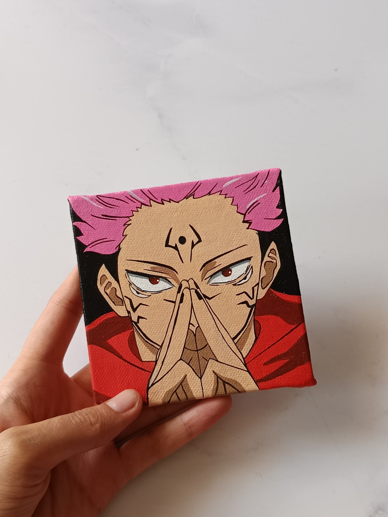 Side view of Ryomen Sukuna hand-painted mini canvas fridge magnet by Tulika Viegas