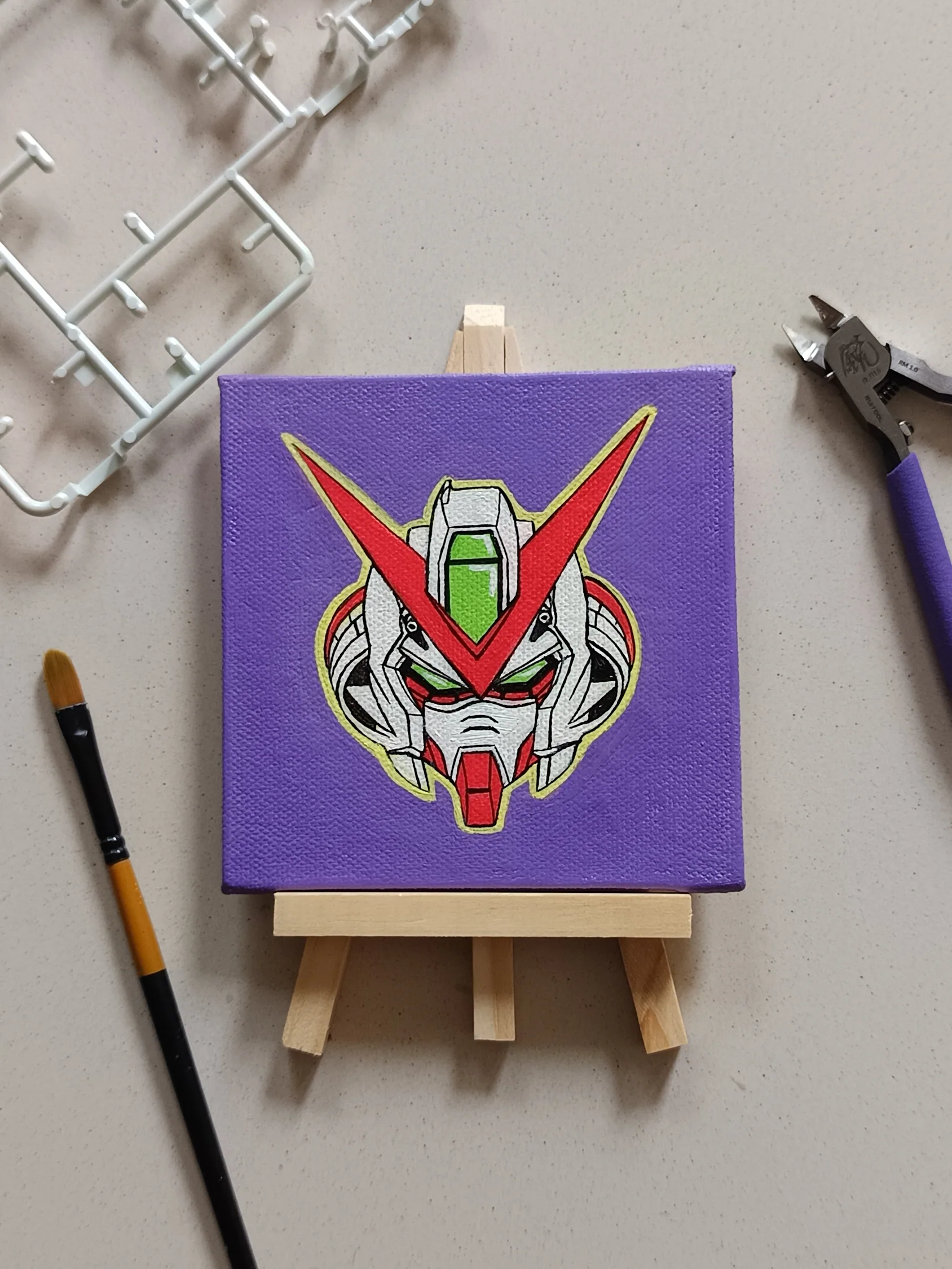 Side view of Red Frame Astray hand-painted mini canvas fridge magnet by Tulika Viegas