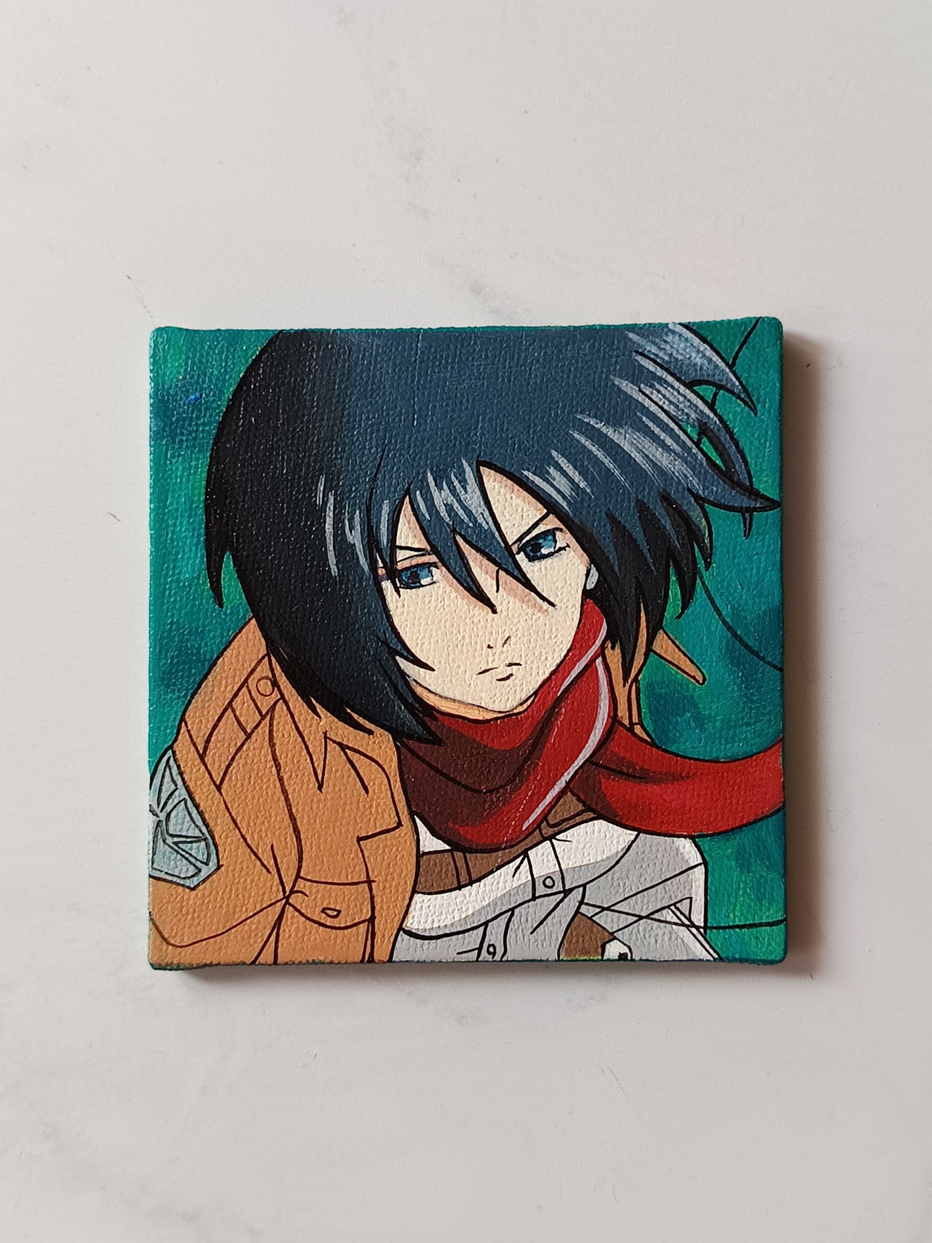 Side view of Mikasa Ackerman hand-painted mini canvas fridge magnet by Tulika Viegas