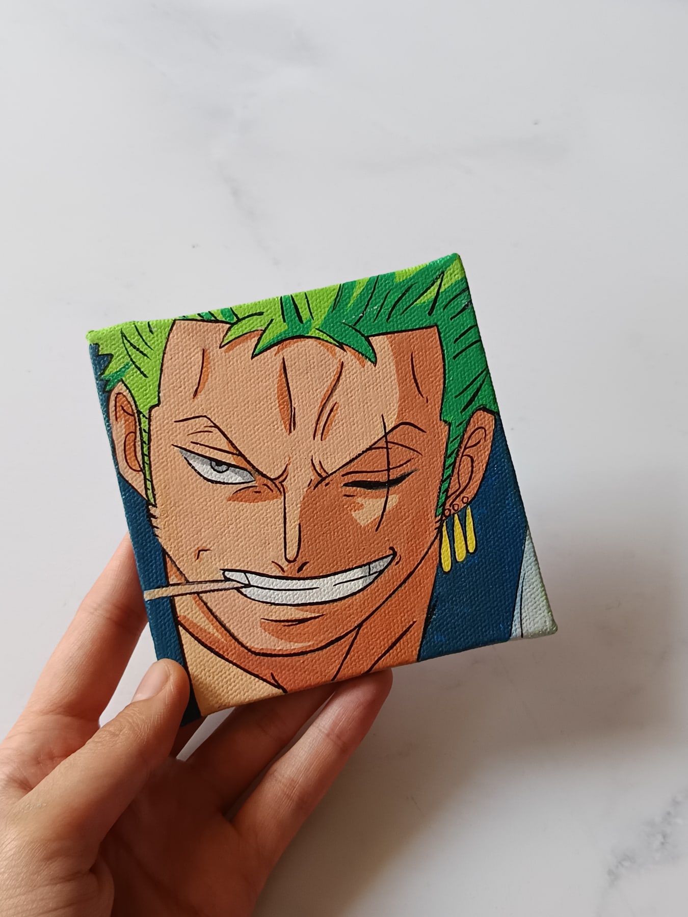Side view of Roronoa Zoro hand-painted mini canvas fridge magnet by Tulika Viegas