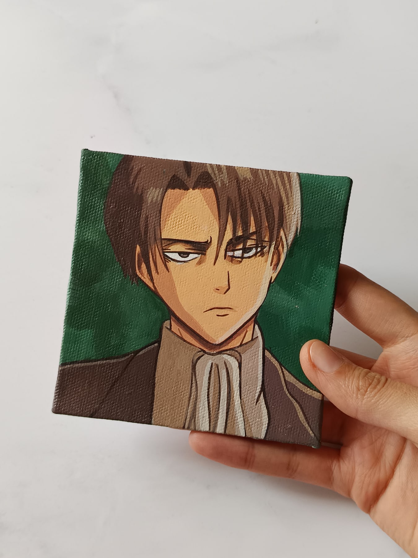 Side view of Levi Ackerman hand-painted mini canvas fridge magnet by Tulika Viegas