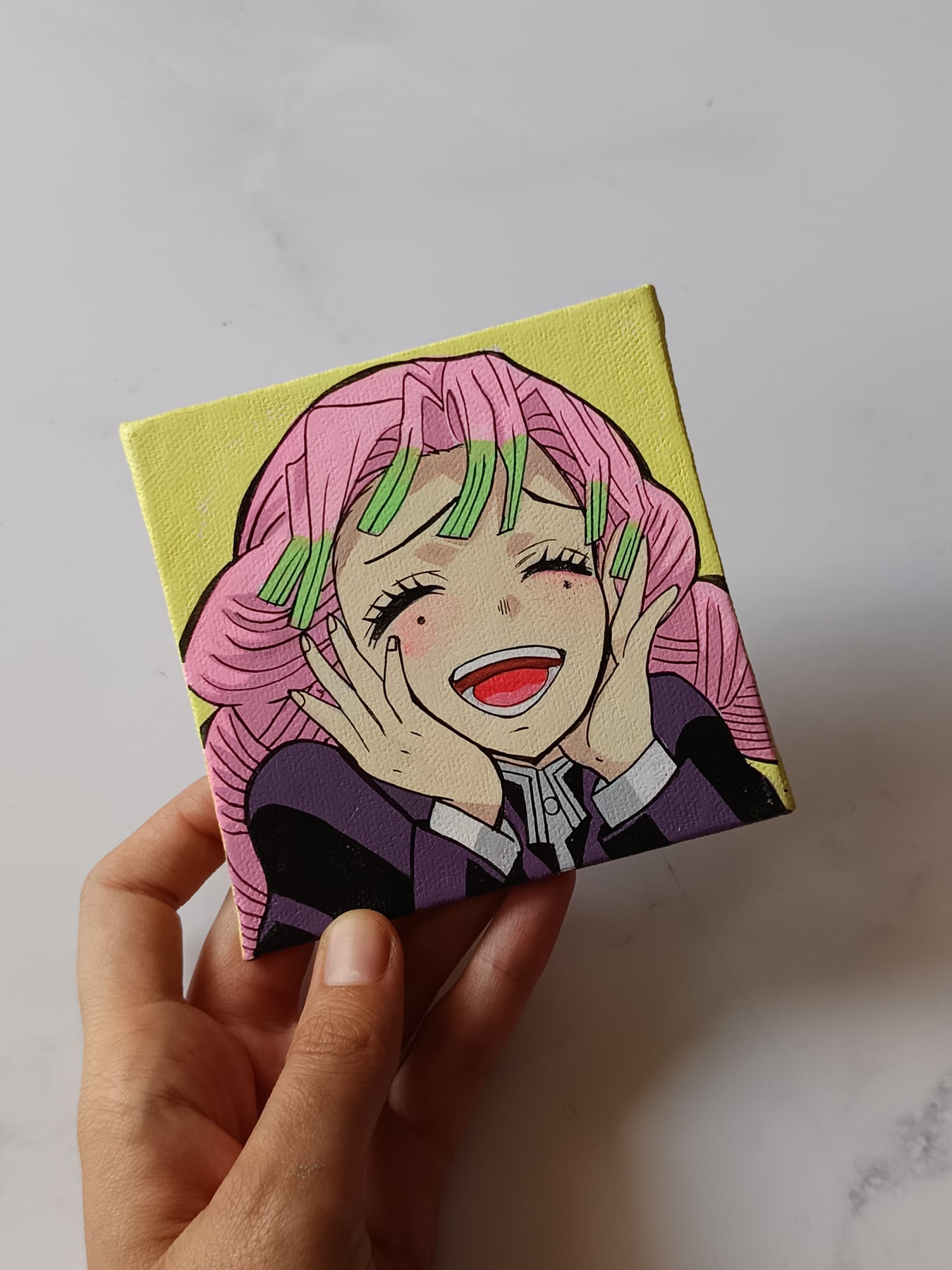 Side view of Mitsuri Kanroji hand-painted mini canvas fridge magnet by Tulika Viegas