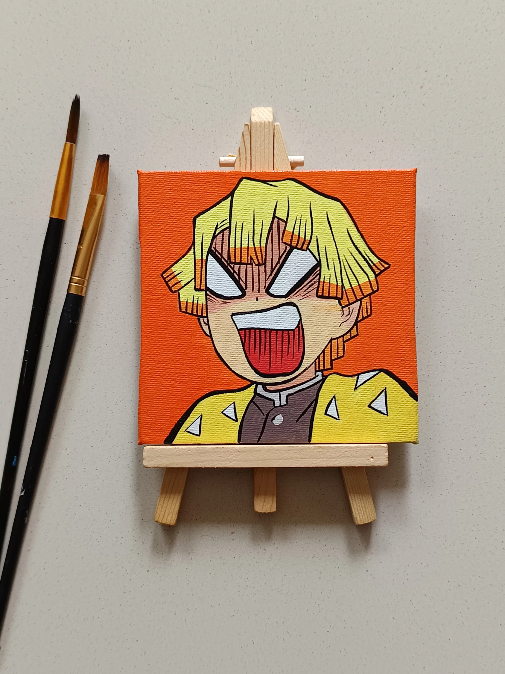 Side view of Zenitsu Agatsuma hand-painted mini canvas fridge magnet by Tulika Viegas