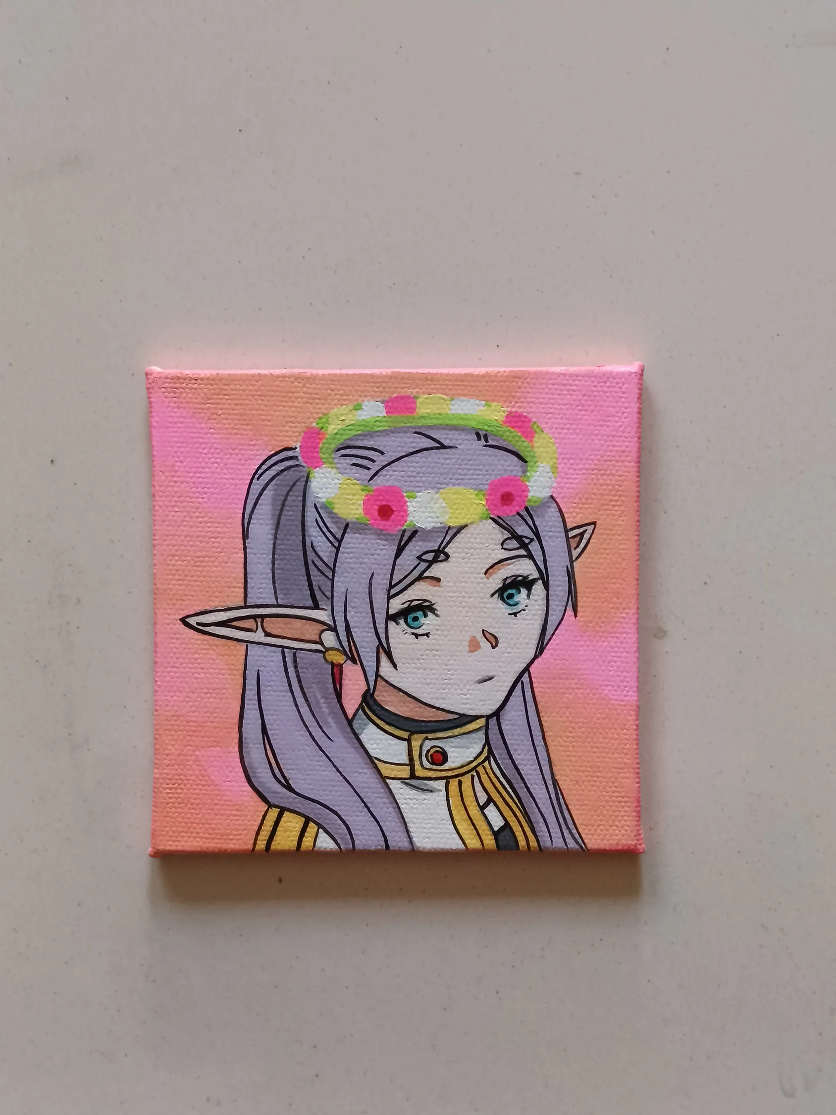 Side view of Frieren hand-painted mini canvas fridge magnet by Tulika Viegas