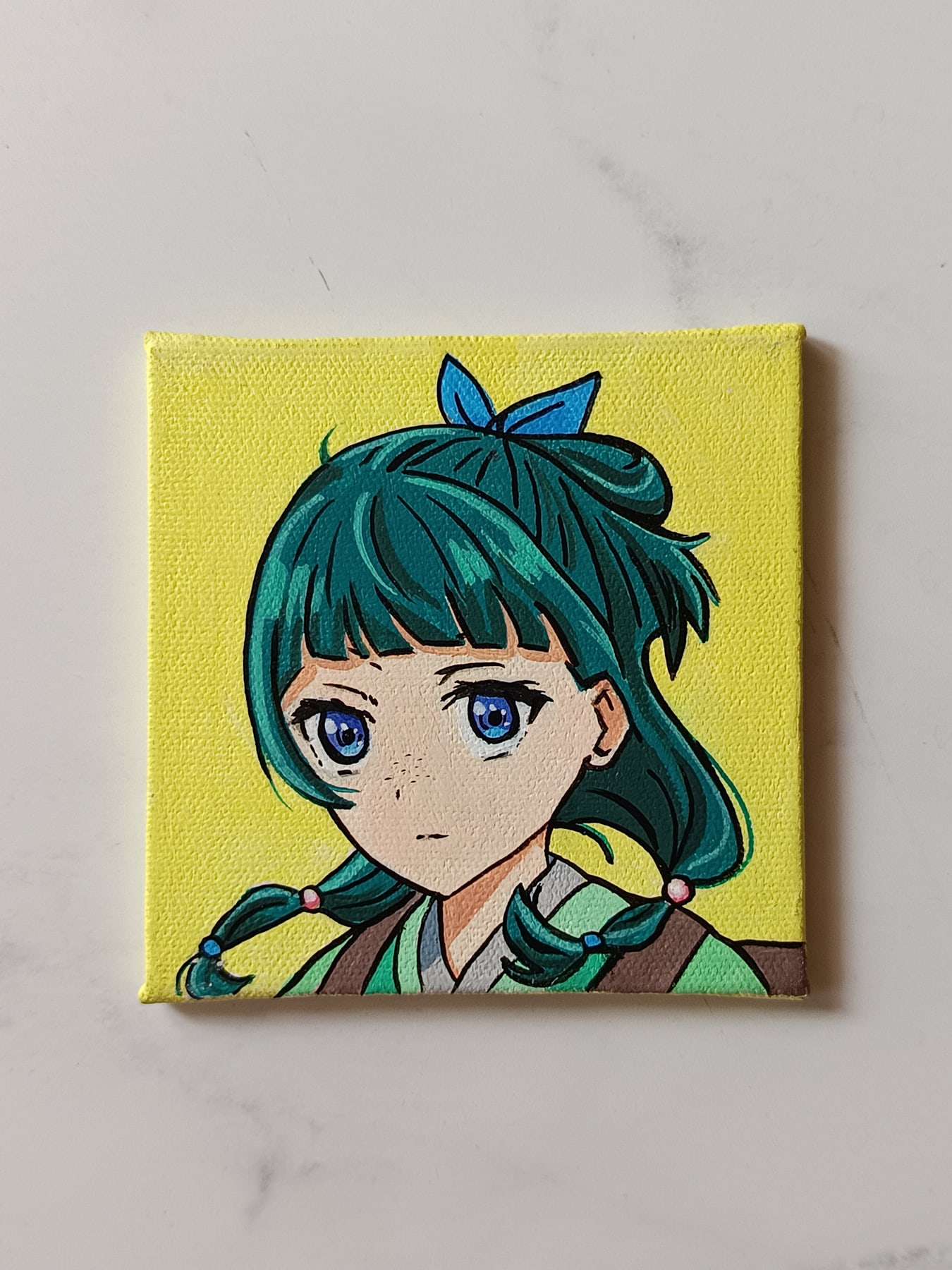 Side view of Maomao hand-painted mini canvas fridge magnet by Tulika Viegas
