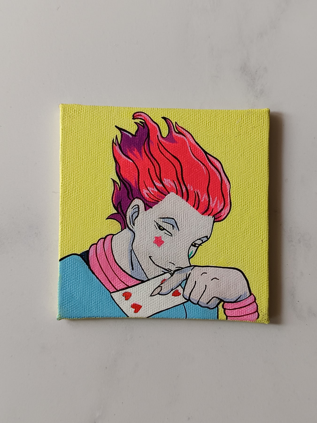 Side view of Hisoka Morow hand-painted mini canvas fridge magnet by Tulika Viegas