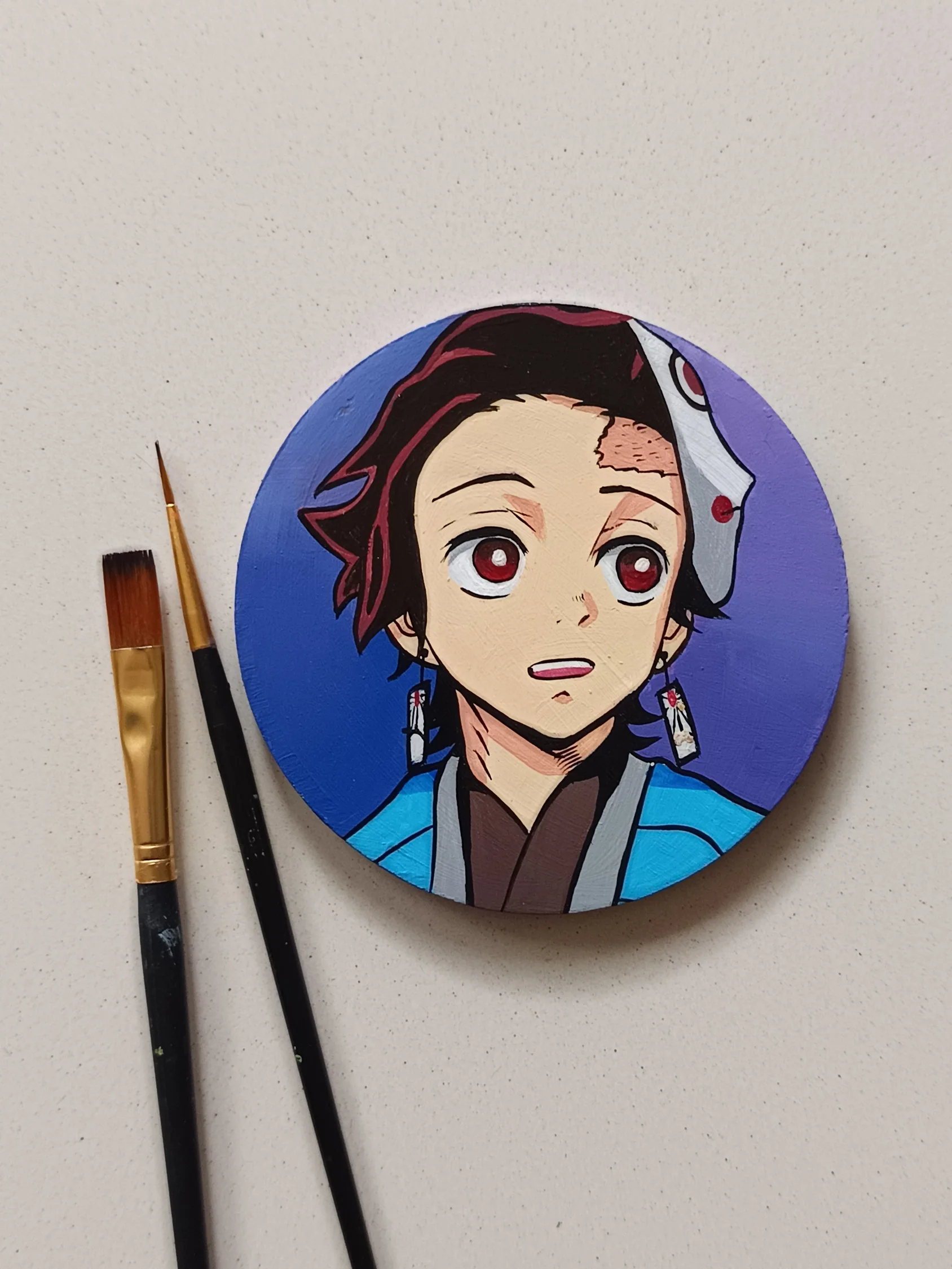 Side view of Tanjiro Kamado hand-painted acrylic coasters by Tulika Viegas