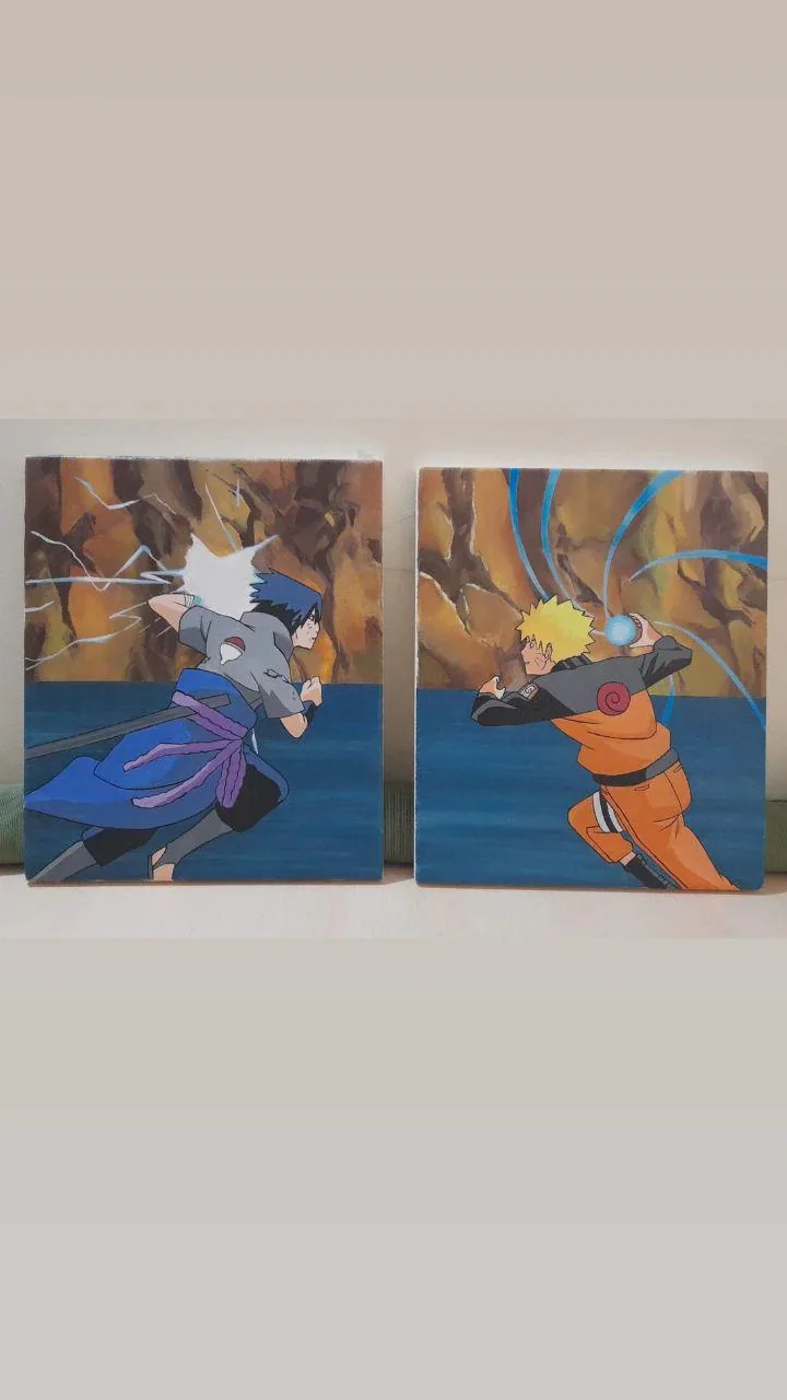 Pair of hand-painted acrylic panels featuring Naruto Uzumaki and Sasuke Uchiha from Naruto in an energetic fight scene.