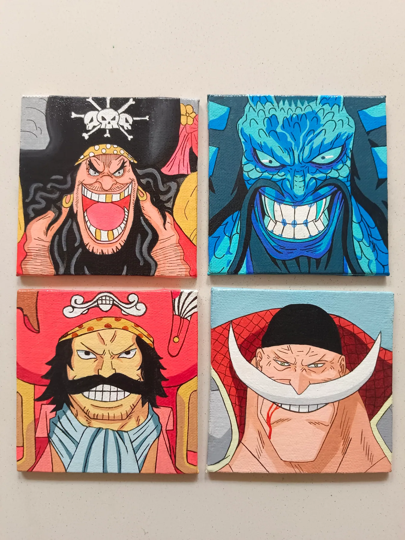 Set of four acrylic One Piece mini canvases featuring Jinbe, Whitebeard, Blackbeard and another pirate character.