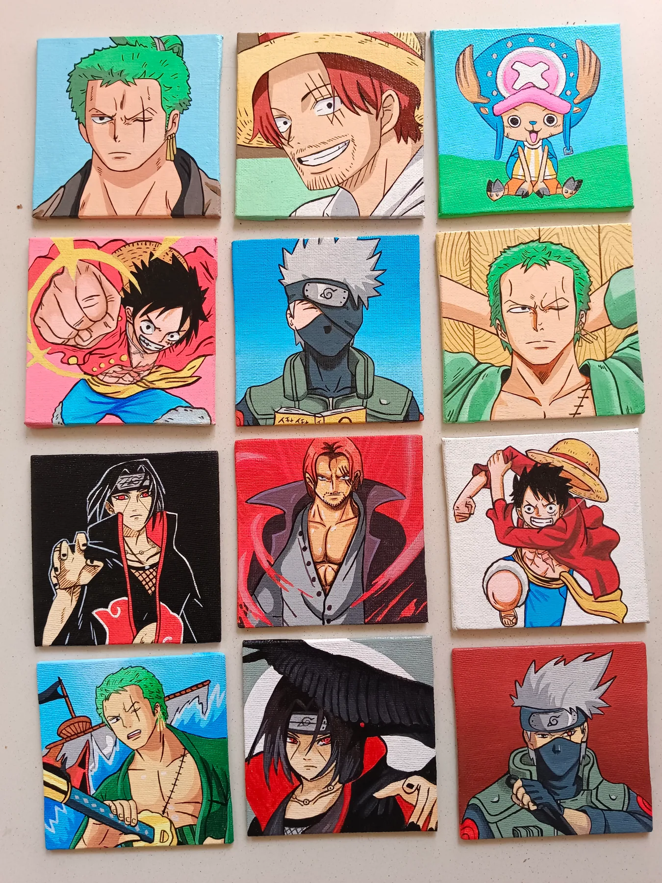 Colourful grid of acrylic mini canvases featuring Monkey D. Luffy, Roronoa Zoro, Tony Tony Chopper, Kakashi Hatake, Itachi Uchiha and other anime characters.