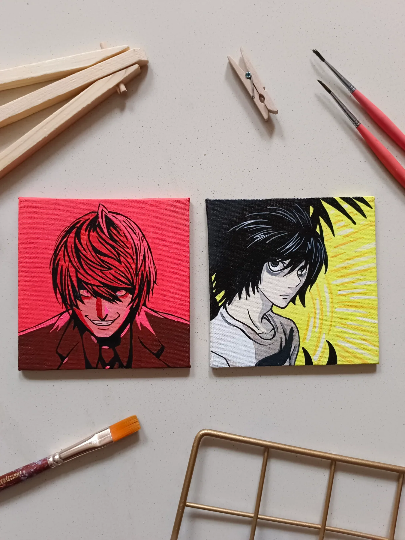 Pair of acrylic mini-canvas portraits featuring Makima from Chainsaw Man and another manga character in red-and-black palettes.