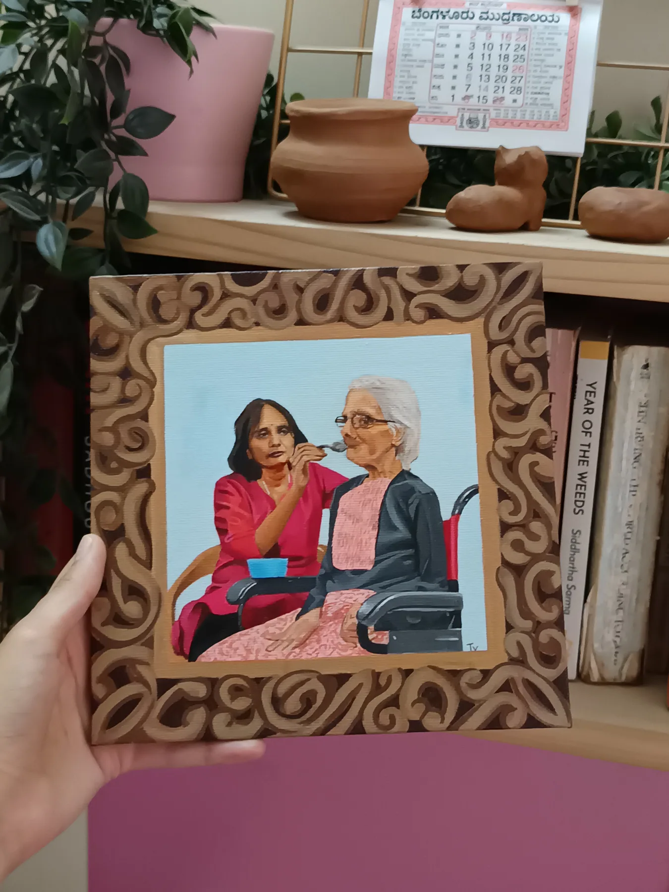 Framed custom family portrait of an older couple seated together, displayed on a shelf as a warm keepsake gift.