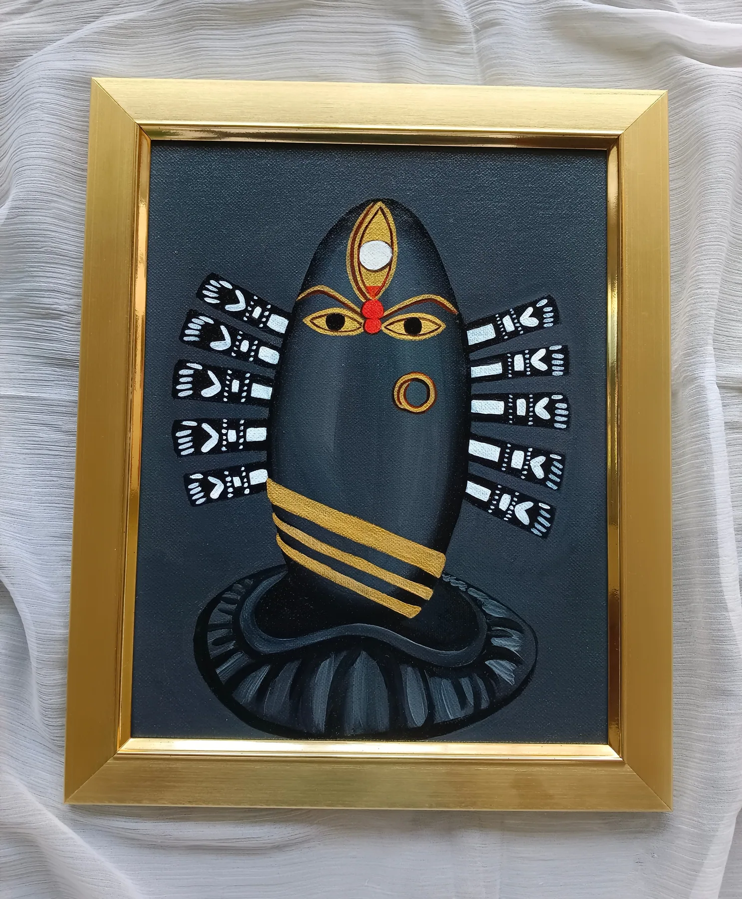 Black framed Bhairavi Devi inspired religious painting with gold details and a calm devotional mood.