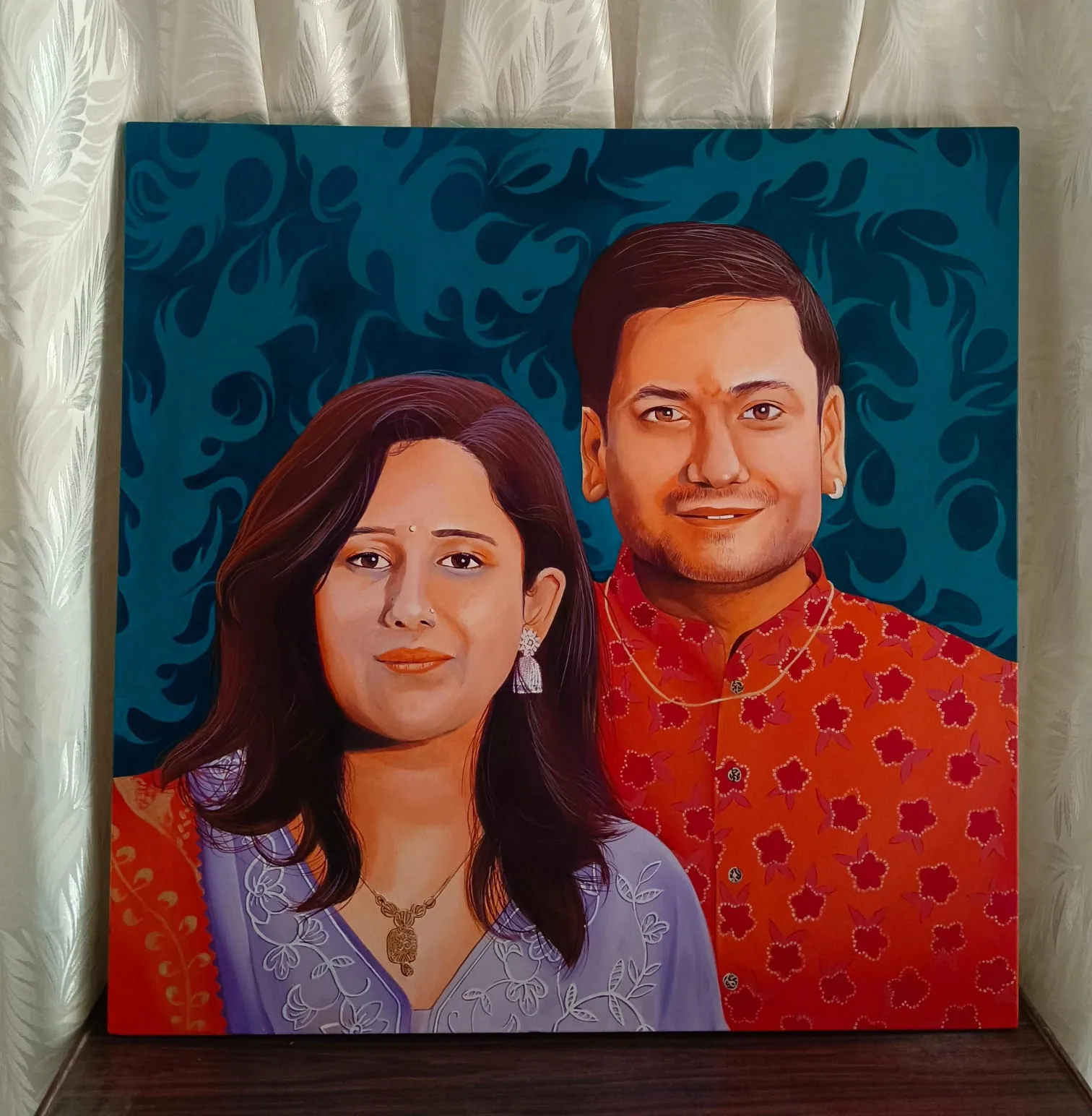 Colourful canvas portrait of a couple against a deep patterned background, painted as a bold custom gift piece.
